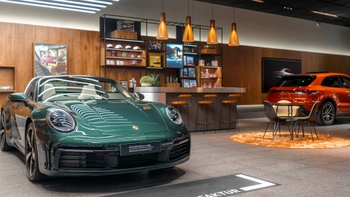 White Porsche Taycan on display
