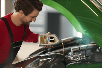 Porsche Technician with Oil