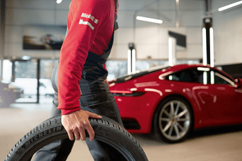 Porsche Technician with Tire