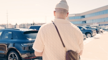 Asif Moola walks up to his 2019 Porsche Macan S