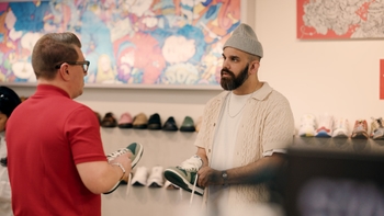 Asif Moola helps a customer at Momentum Clothing in Saskatoon