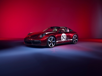 Front 45 degree angle of Porsche 911 Targa 4S Heritage Design in ambient lighting