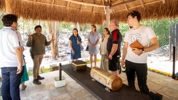 Host explaining the schedule of the day to Porsche clients