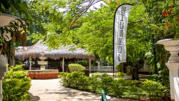 Entrance of the hotel decorated with a Porsche banner