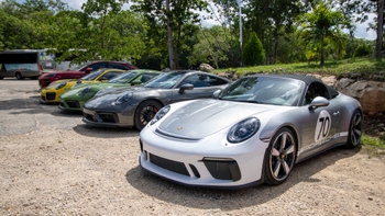 Porsche cars parked one next to the other