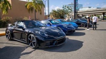 Porsche cars parked one next to the other