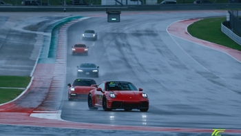 Red Porsche GT3 leading the way on the racing track