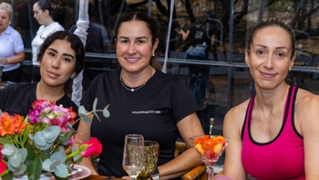 Three female clients smiling for the picture