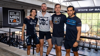 Three male clients and the spinning instructor