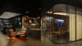 Interior of Porsche Studio showing a brand new 911 red model