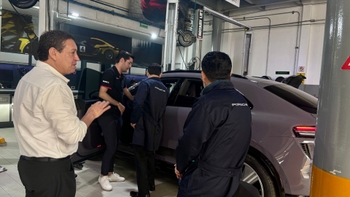 Porsche clients getting assessed by Porsche technicians