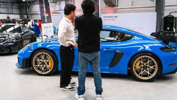 Two people admiring the 911 exclusive model at Le Mans Watching Party