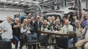 A group of Porsche gentlemen enjoying some beverages at Le Mans Watching Party