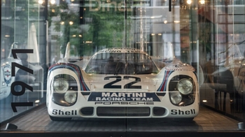 this is a white classic sport Porsche on display