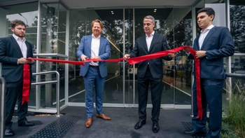 Porsche associates cutting the welcome ribbon